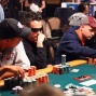 Phil Ivey watches as Joe Ward rechecks his card after the bet.