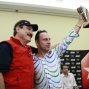 Amer poses with the trophy and Humberto Brenes