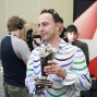 Amer poses with the trophy