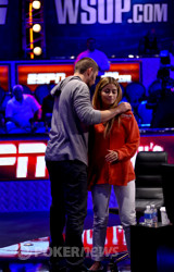 David Sands gives girlfriend, Erika Moutinho, a hug after he busted out in 30th place from the Main Event