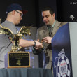 Jack Effel presents the gold bracelet to Paul Volpe, winner of Event #13: $10,000 No-Limit 2-7 Draw Lowball Championship
