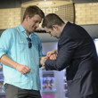 Jack Effel places the gold bracelet on Mike Kachan's wrist. Event #56: $1,000 No-Limit Hold'em