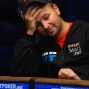 Daniel Negreanu appears emotionally drained with just enough chips to make the small blind