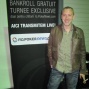 Guillaume Darcourt în fața panoului PokerNews