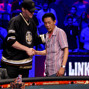 Phil Hellmuth shakes hands with Minh Ly, who he eliminated in 3rd.
