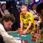 Max Heinzelman passes some of his chips over after losing an all in call.