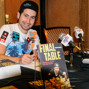 Jonathan Duhamel signing copies of his book "Final Table"