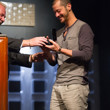 Athanasios Polychronopoulos accepting his bracelet from Nolan Dalla