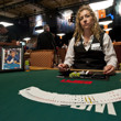 A portrait of Dr. Jerry Buss sits on the table next to an honarary stack of chips for $2500 Seven Card Stud Event at the WSOP.