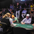 Players at the final table in Event 28 and their supporters on the rail