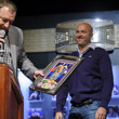 WSOP Executive Director Ty Stewart presents the winners photo to Justin Oliver, winner of Event #38: $2,500 No-Limit Hold'em (Four Handed)