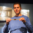 Norbert Szecsi displays his gold bracelet