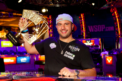 Michael Mizrachi holds aloft the David "Chip" Reese Trophy after winning his second $50,000 Poker Players' Championship in 2012