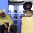 Doyle Brunson getting a good look at the recently commissioned bust