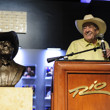 Doyle takes the stage, telling players in the Main Event to "Shuffle Up and Deal!"