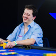 Anthony Ghamrawi slides his stack forward for the dealer to count