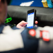 Jonathan Duhamel catches up with the action from the PokerNews app