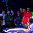Players watch on as the flop is dealt
