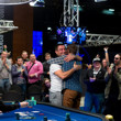 Hossein Ensan hugs it out with Gleb Tremzin after the final hand