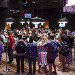 Spectators line the rail of The Poker Players' Championship Tournament Area