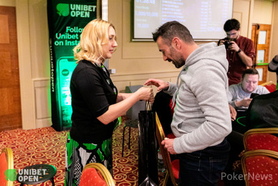 Cedric Freling receiving champagne from Kasia Scanlon as a bubble prize