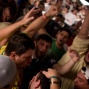 Alexandre Gomes ( center bottom ) is swamped by Brazilian fans