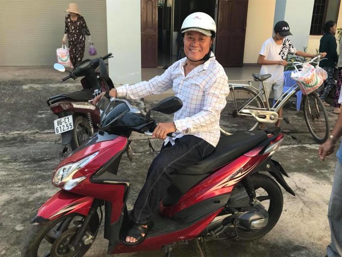 Men  "The Master" Nguyen on his scooter