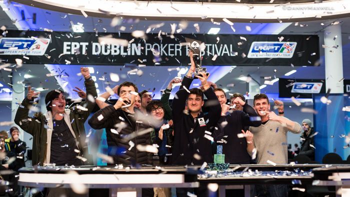 Dzmitry Urbanovich lifting the trophy, with Sebastian Malec on his right