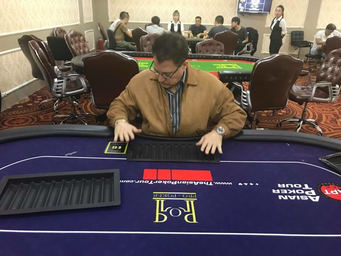 Greg Grivas gets behind the poker table in Vietnam.