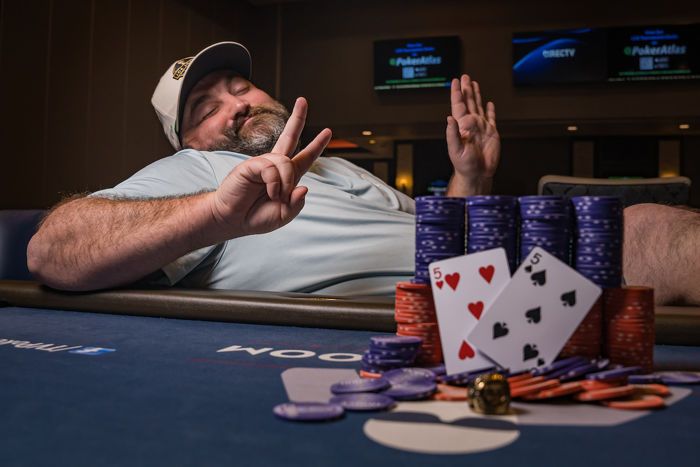 Scott Stewart poses with his seventh WSOPC ring.