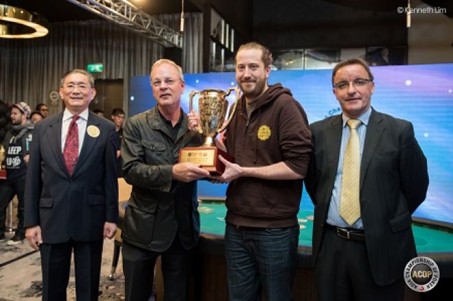 Poker Hall of Famer Bobby Baldwin presents Steve O'Dwyer with the trophy.