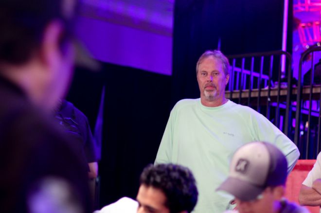 Paul Gilbert watched Phil Hellmuth in the Amazon Room.