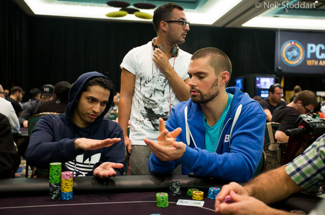 Mohsin Charania (left) and Doc Sands (right) play "Rock, Paper, Scissors"