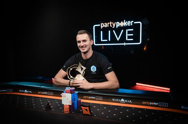 Steffen Sontheimer poses after his win in the CPP $250,000 Super High Roller Championships