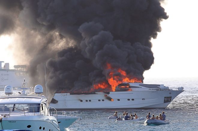 poker player burning yacht